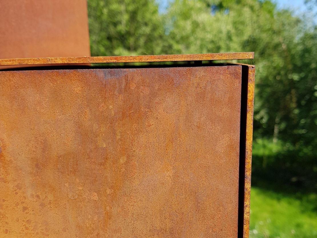 Nicely finished sheet metal of a terrace stove in wathering steel cor-ten Nicely finished sheet metal of a terrace stove in wathering steel cor-ten