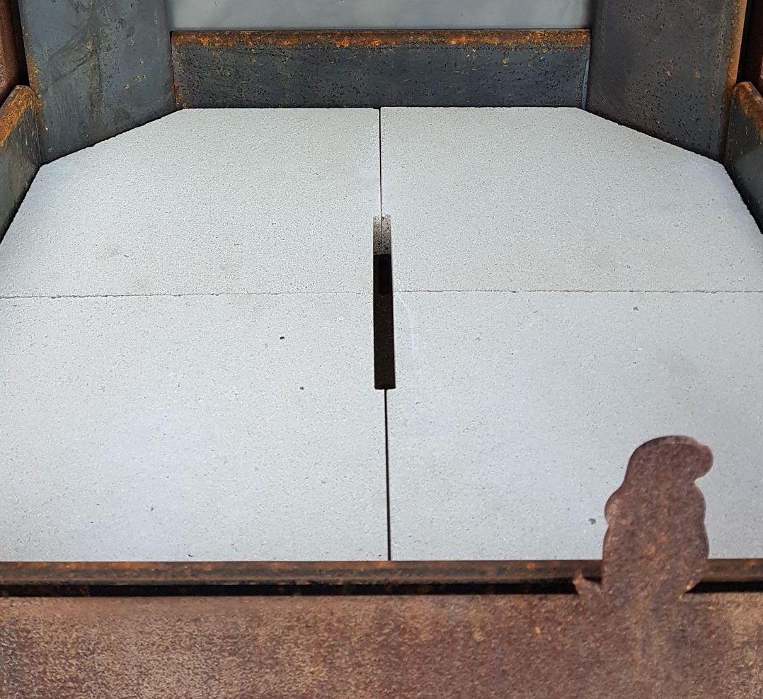 Refractory stones in a garden heater for wood , made from wathering steel Refractory stones in a garden heater for wood , made from wathering steel